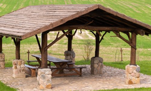 Wooden gazebo standing on the territory near the estate.